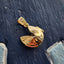 A stylish solid gold fortune cookie charm that can be opened. This charm has a3 dimensional design.