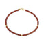 A faceted beaded gemstone bracelet with three gold bead accents and lobster clasp. Available in twelve natural gemstones.