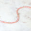 A faceted beaded gemstone bracelet with three gold bead accents and lobster clasp. Available in twelve natural gemstones.