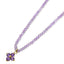 A faceted beaded necklace with a solid gold flower pendant attached. available in amethyst or pink tourmaline.