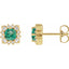 Gold earrings with green gemstones and clear stones on a white background