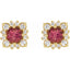Gold earrings with red gemstones and diamond-like stones on a white background