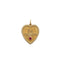 A solid gold heart pendant with beaded border. Old English Font " Toi Toujours" and a diamond in the center. Overall a vintage feeling.