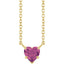 Gold necklace with a heart-shaped purple gemstone on a white background