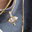 A product picture of a marquise diamond eye pendant. This pendant is made of solid gold, bezel set with two layers with ray pattern on the inner most layer. This pendant also has a four diamond bail and a gold tear drop. Photo showing with other diamond charms.