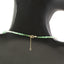 A emerald necklace with an ombre look, created with different shaded green and gold bead spacing.