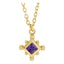 Gold necklace with a purple gemstone pendant on a white background