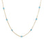 A solid gold station necklace with beaded gemstones evenly spaced out.