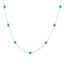 A solid gold station necklace with beaded gemstones evenly spaced out.