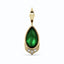 Solid gold green pear shaped tsavorite gemstone pendant with three baguette diamonds set at the bottom.