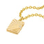 A gold book locket with a diamond on the right hand center at the opening. Finished with ray designs and jump ring bail.