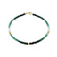 A faceted gemstone ombre beaded bracelet with three gold accents and a round clasp.
