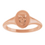 An oval signet ring with a three dimensional skull set on its surface. This ring has a vintage vibe.