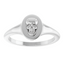 An oval signet ring with a three dimensional skull set on its surface. This ring has a vintage vibe.