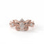 Rose gold butterfly-shaped earring with diamonds on a white background