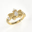 Gold ring with butterfly design and diamonds on a white background