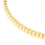 A gold bangle bracelet with ribbed square pattern. Very classic and looks best stacked.