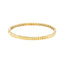 A gold bangle bracelet with ribbed square pattern. Very classic and looks best stacked.