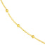 Solid yellow gold beaded station chain with a gold beaded accent evenly spacing out on a cable chain. Close up