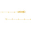 Solid yellow gold beaded station chain with a gold beaded accent evenly spacing out on a cable chain. Clasp