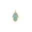 A hamsa charm with laced design overlaying a turquoise gemstone. Solid 14k gold.