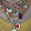 A rainbow colored opal strand beaded necklace made with gold filled wheel clasp.