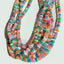 A rainbow colored opal strand beaded necklace made with gold filled wheel clasp.
