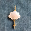 A storm cloud pendant with a hand carved gemstone and a solid gold charm attached at the bottom of the cloud.