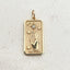 A tarot card inspired pendant with different face card designs such as love, rose, hourglass, the sun, the moon, the stars, and courage.