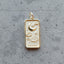 A tarot card inspired pendant with different face card designs such as love, rose, hourglass, the sun, the moon, the stars, and courage.