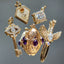 a collection of solid gold charms and pendants