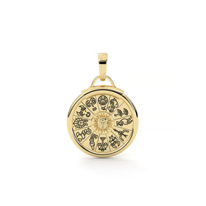 Gold pendant with zodiac symbols on a white background