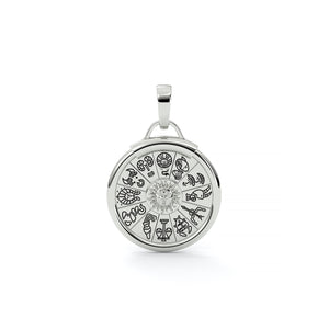 Silver pendant with zodiac symbols on a white background