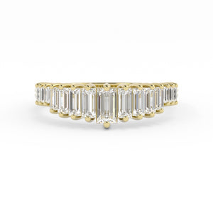 Gold ring with emerald-cut diamonds on a white background