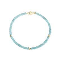A faceted beaded gemstone bracelet with three gold bead accents and lobster clasp. Available in twelve natural gemstones. 