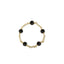Gold bracelet with black beads on a white background