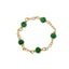 Gold bracelet with green beads on a white background