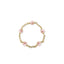 Gold bracelet with pink pearls on a white background