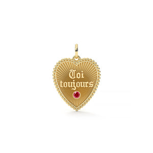 Gold heart-shaped pendant with 'Toi toujours' engraving and red gemstone on a white background