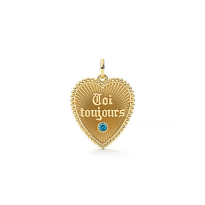 Gold heart-shaped pendant with 'Toi toujours' engraving on a white background