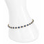 Gold bracelet with blue stones on a white mannequin wrist
