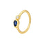 A pear blue sapphire ring set in bezel setting with a round diamond