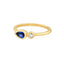 A pear blue sapphire ring set in bezel setting with a round diamond