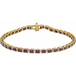 Gold bracelet with purple gemstones on a white background