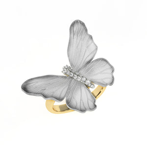 Butterfly-shaped ring with gold and silver design on a white background