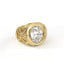 Gold ring with a large diamond on a white background