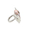 A ring made in silver with a candy wrapper design. The candy is made is different size pearls in various shades of pink.