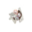 A ring made in silver with a candy wrapper design. The candy is made is different size pearls in various shades of pink.