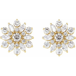 Gold and crystal flower-shaped earrings on a white background