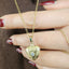Gold heart-shaped necklace with a lock on a brown background